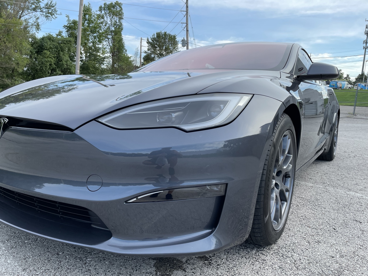 Gray Tesla Plaid photographed outdoors after PPF, tint and ceramic coating