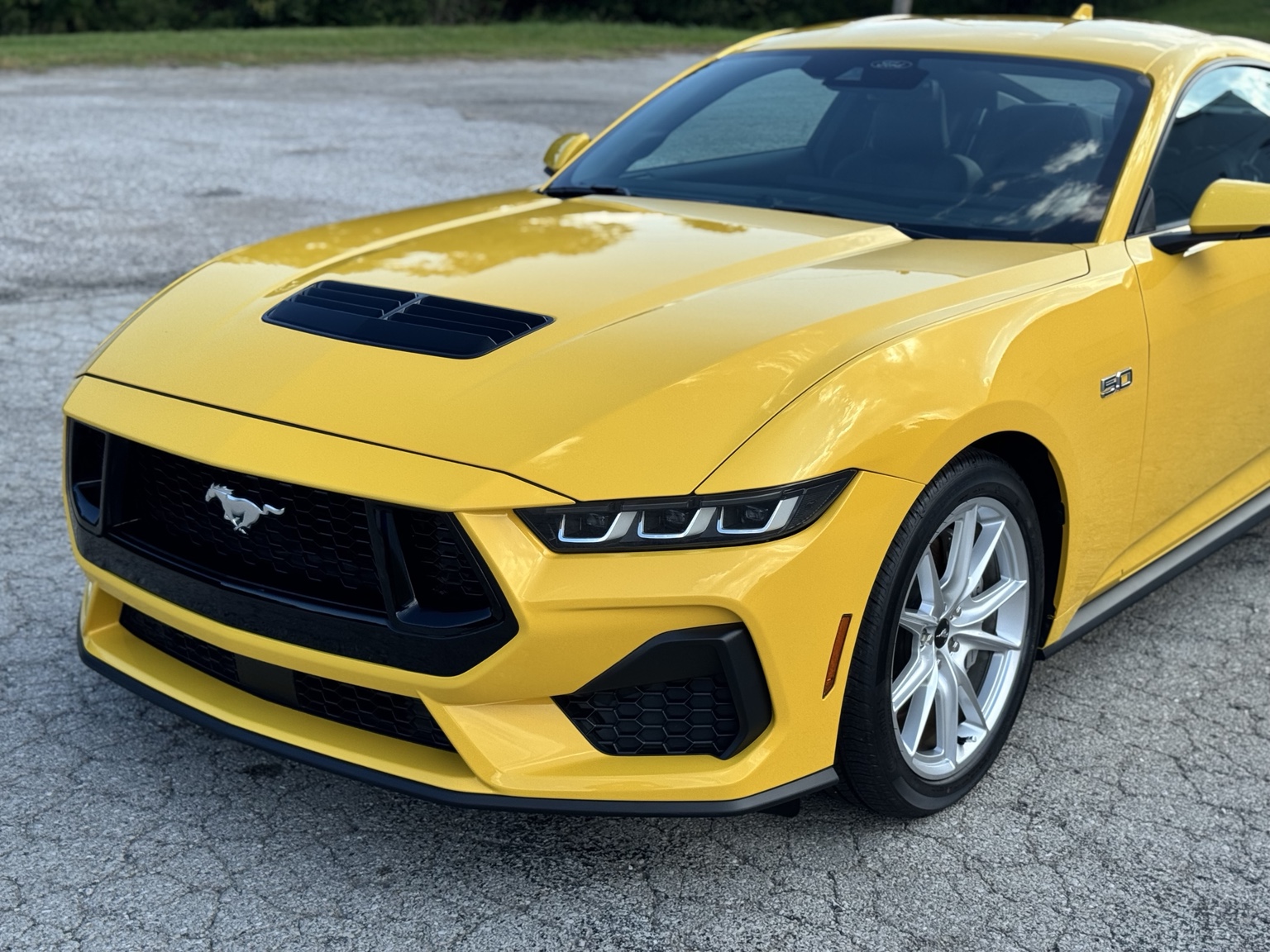 Yellow Ford Mustang with a clearly visible front-end finish