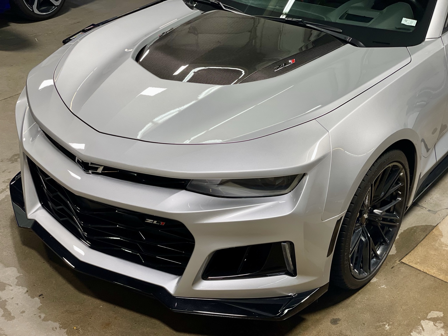 Silver Chevrolet Camaro ZL1 photographed inside the shop