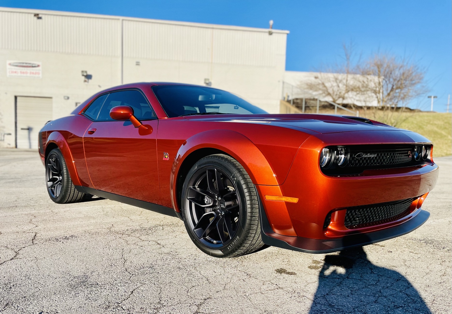 Orange Dodge Challenger photographed outdoors