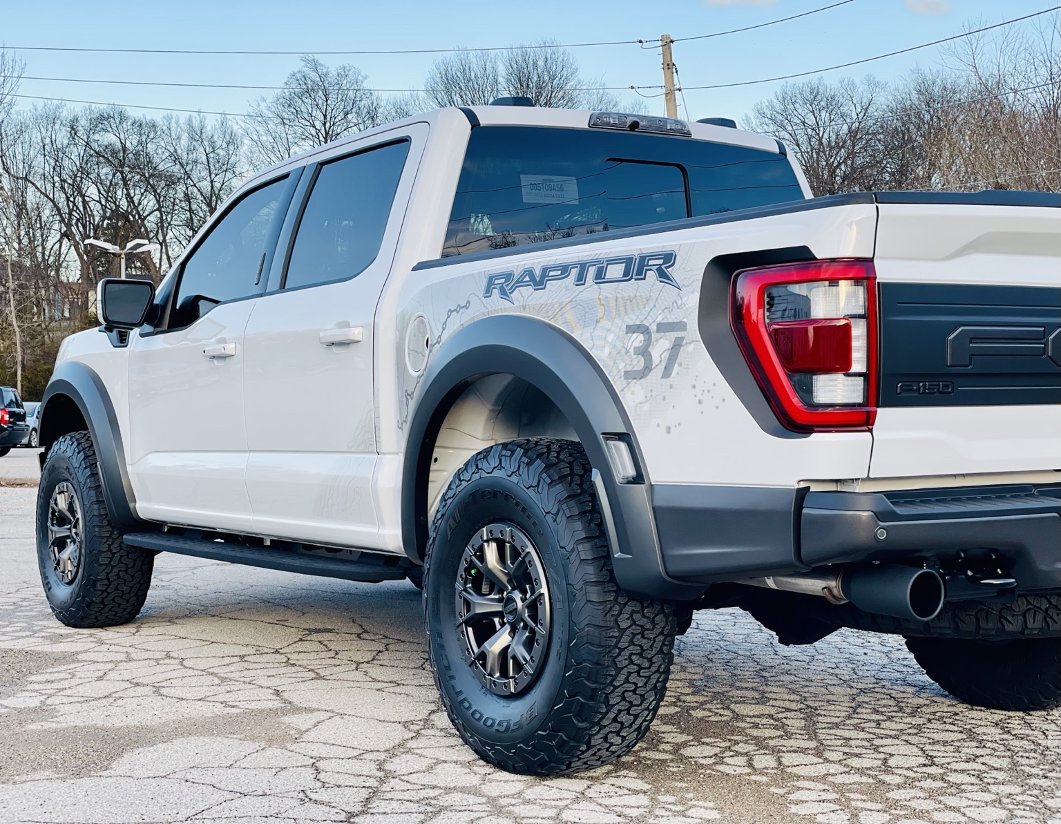 White Ford F-150 Raptor photographed outside the Arnold shop