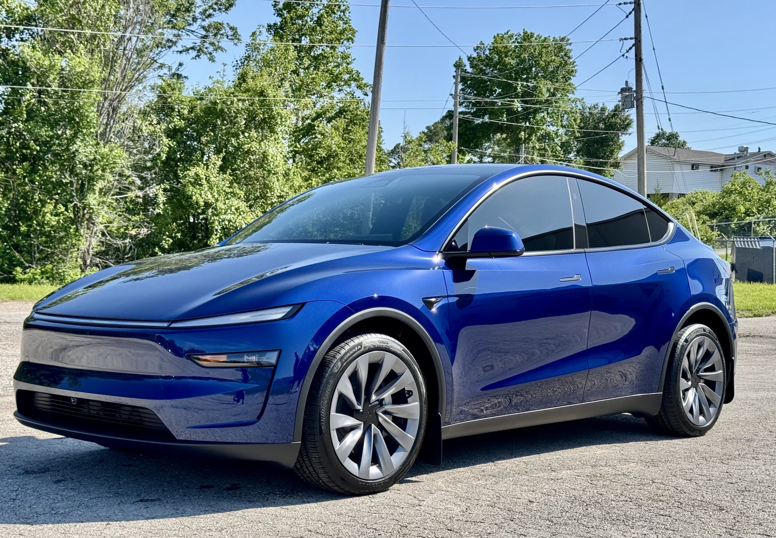 Blue Tesla Model Y protected by STL Auto Defenders near St Louis