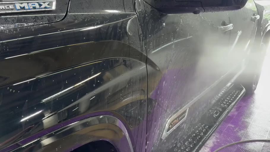 Water reacting to a hydrophobic ceramic coating applied by STL Auto Defenders